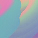 a cell phone with a blurry background of pink and blue